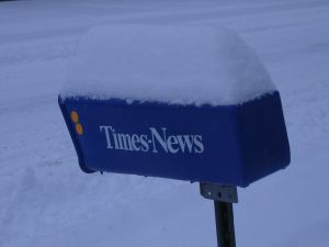 snow on newspaper box