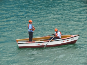 men in rowboat